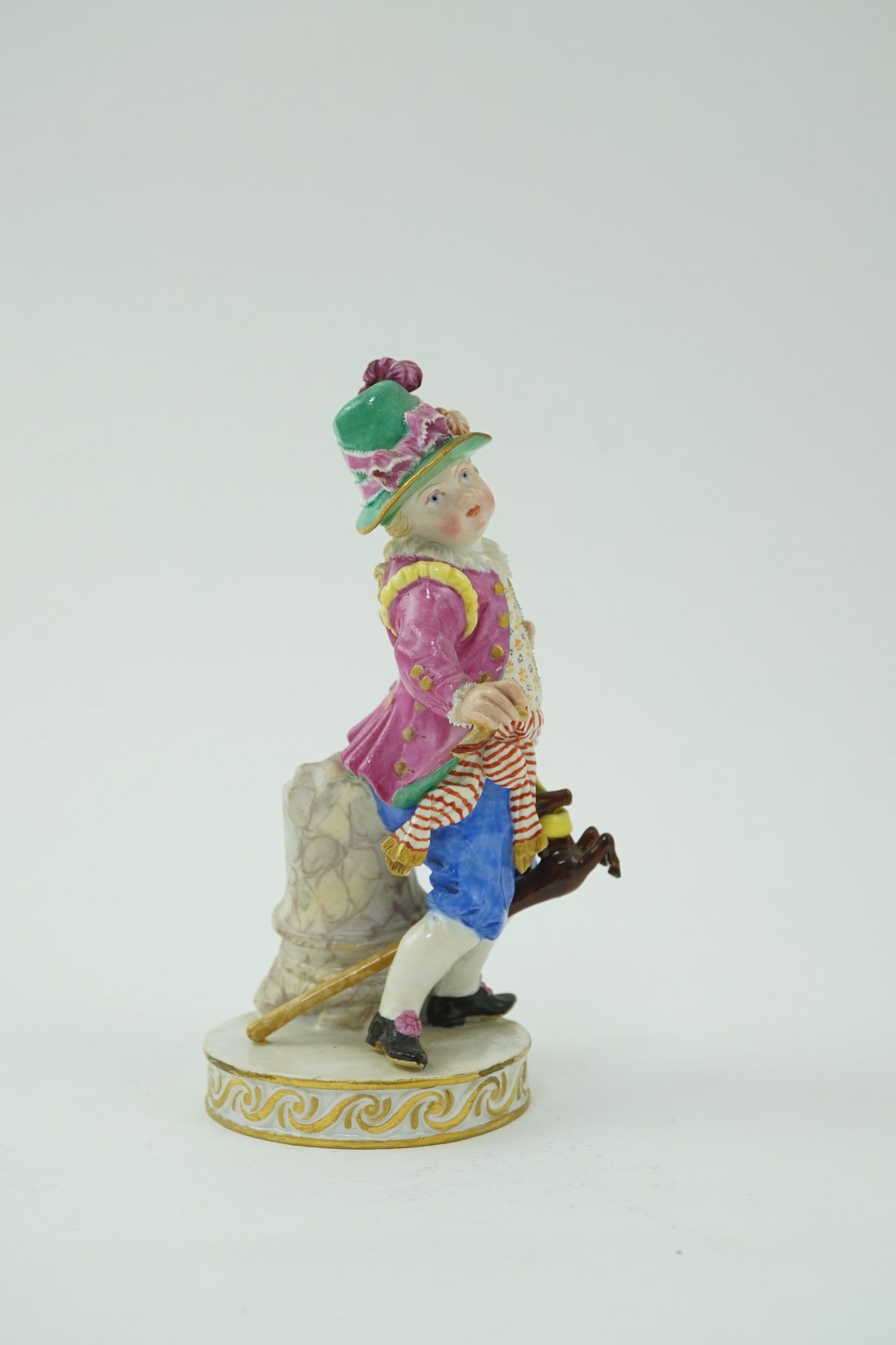 A Meissen figure of a boy on a hobby horse, 19th century